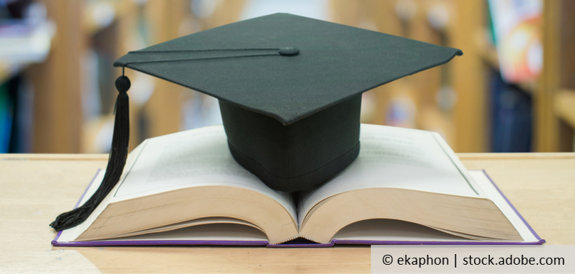 A graduation hat on a book